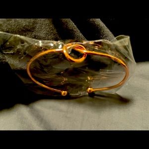 rose gold tone adjustable bangle bracelet with round knot